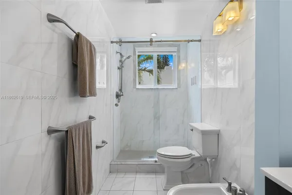 a bathroom with a sink a toilet and vanity