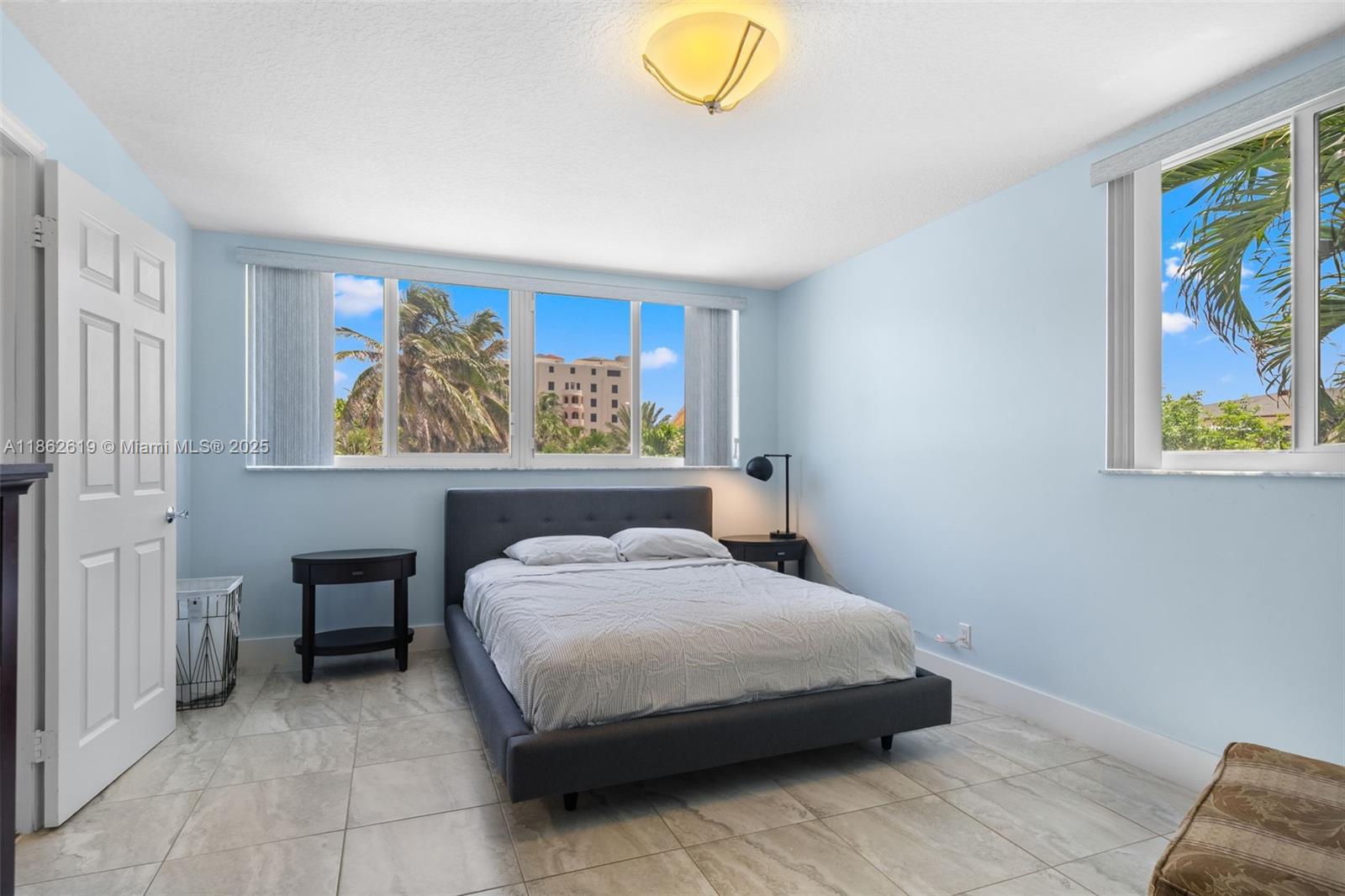 311 North Surf Road, Unit 311 Hollywood, FL 33019 - Photo 50 of 68 a bedroom with a bed and painting on the wall