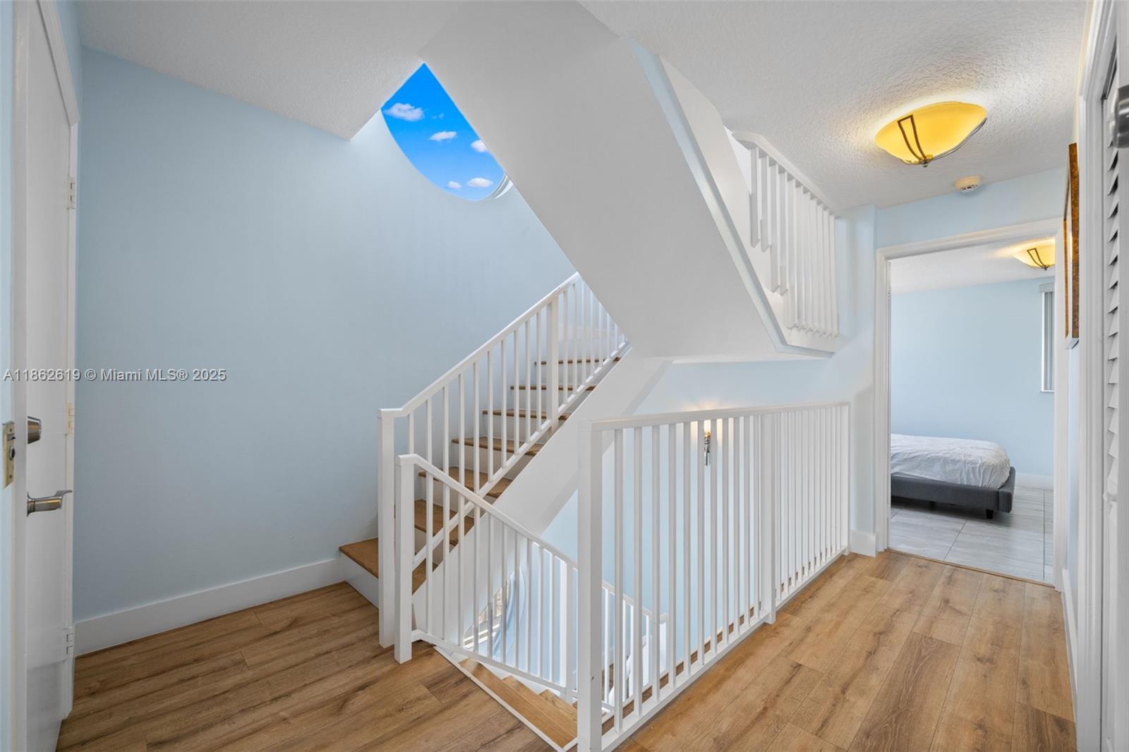 311 North Surf Road, Unit 311 Hollywood, FL 33019 - Photo 51 of 68 a view of entryway and hall with wooden floor