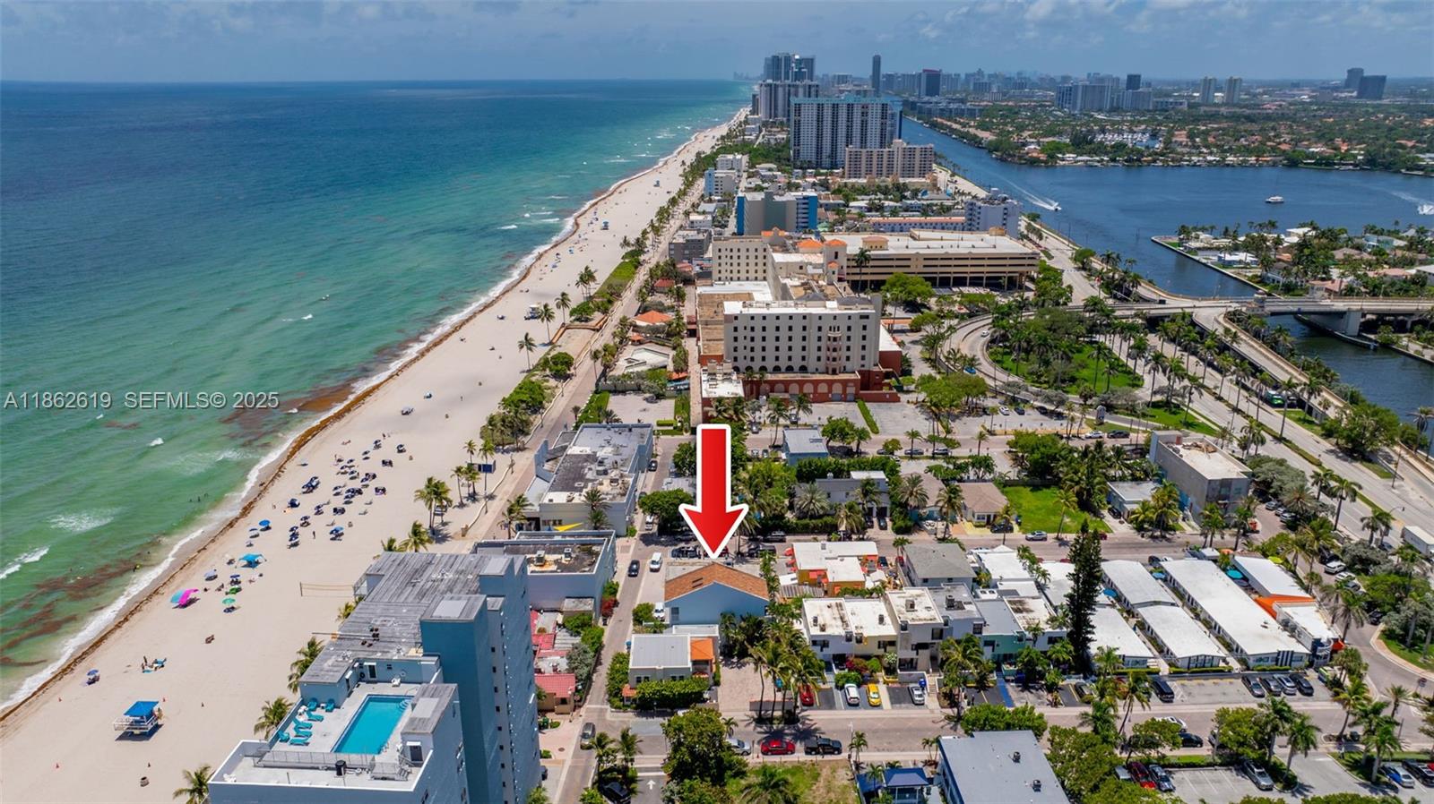 311 North Surf Road, Unit 311 Hollywood, FL 33019 - Photo 10 of 68 a view of building with yard and ocean view