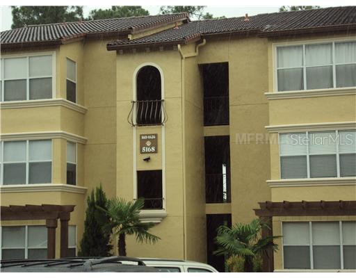 5168 Conroy Road, Unit 1636 Orlando, FL 32811 - Photo 1 of 1 a front view of a building with a garden
