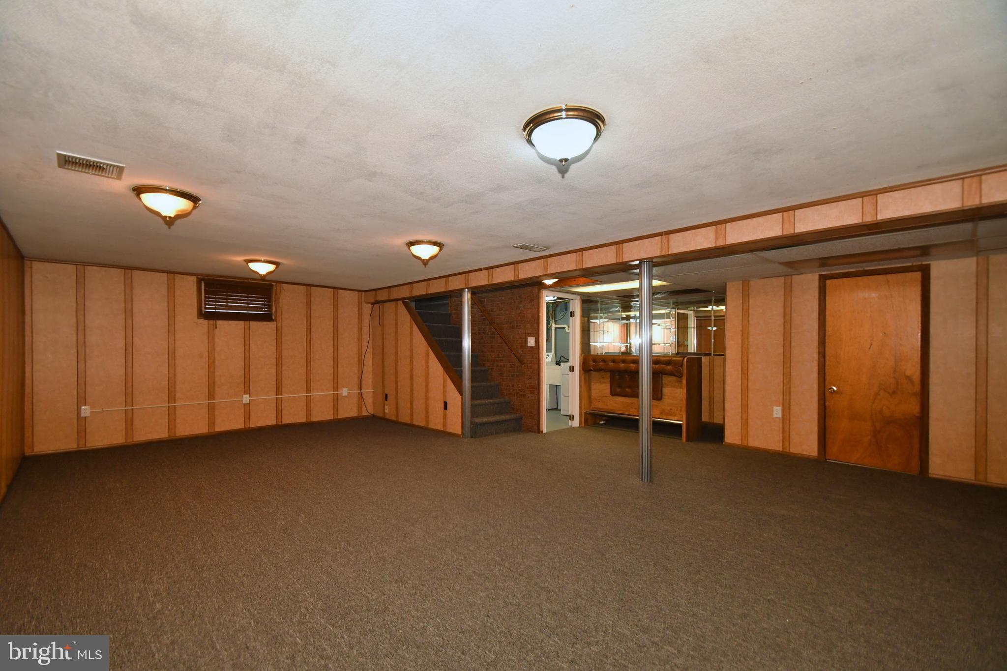 811 Milford Mill Road Baltimore, MD 21208 - Photo 30 of 49 Lower level family room