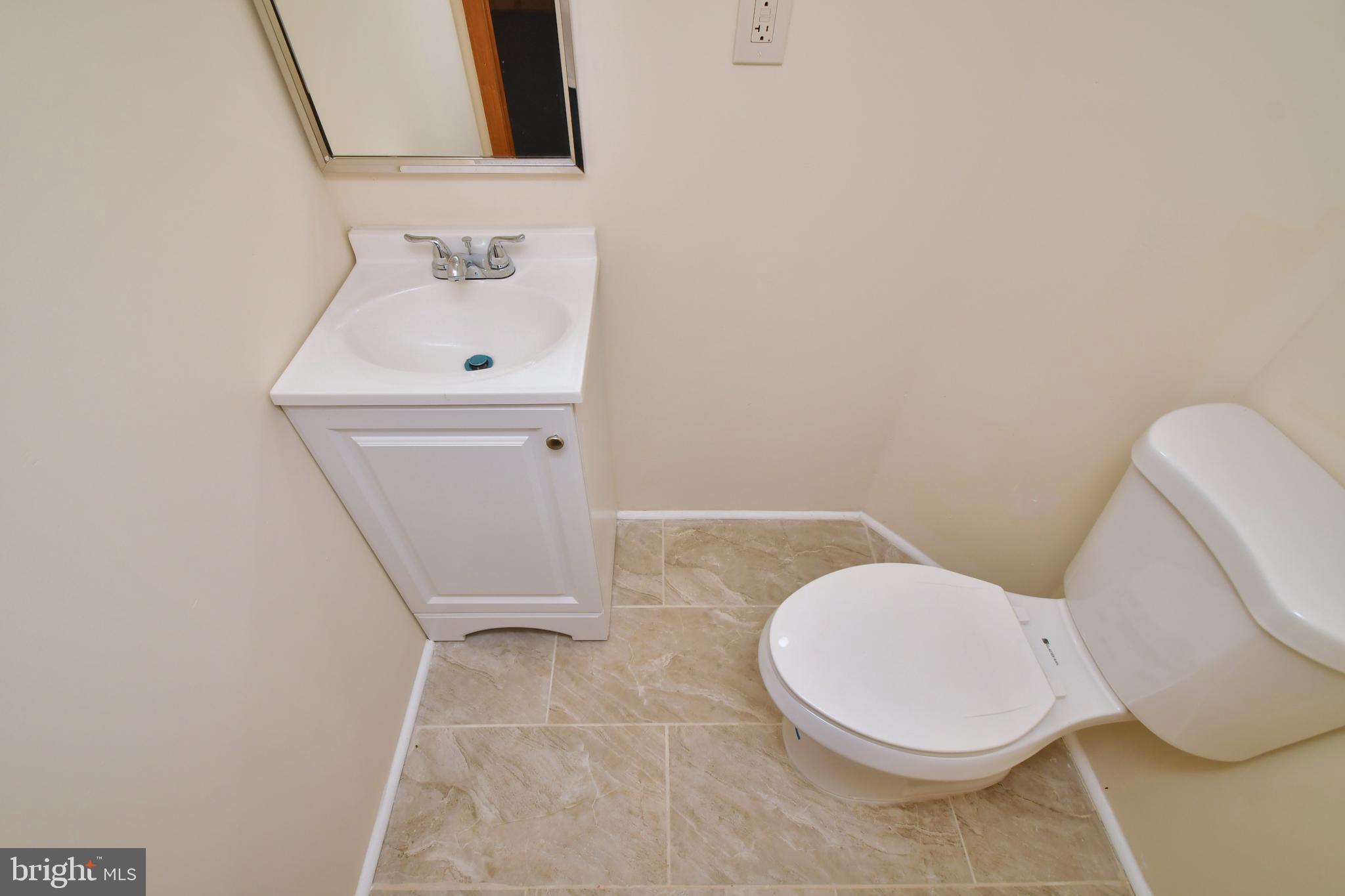 811 Milford Mill Road Baltimore, MD 21208 - Photo 34 of 49 Half bath on lower level