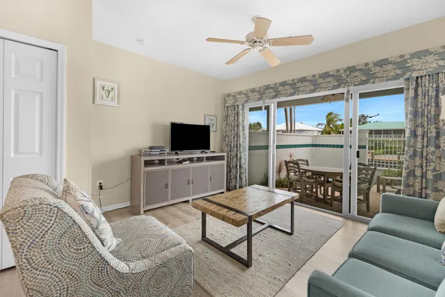 a bedroom with a bed dresser and a window