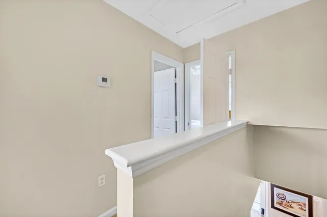 a view of a lake with a table and chairs