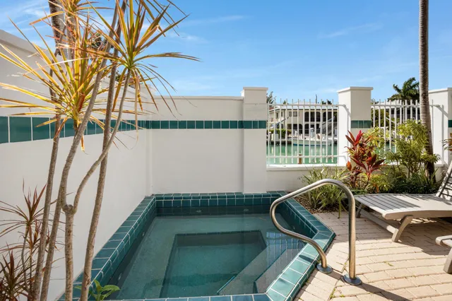 a bedroom with a bed and a table