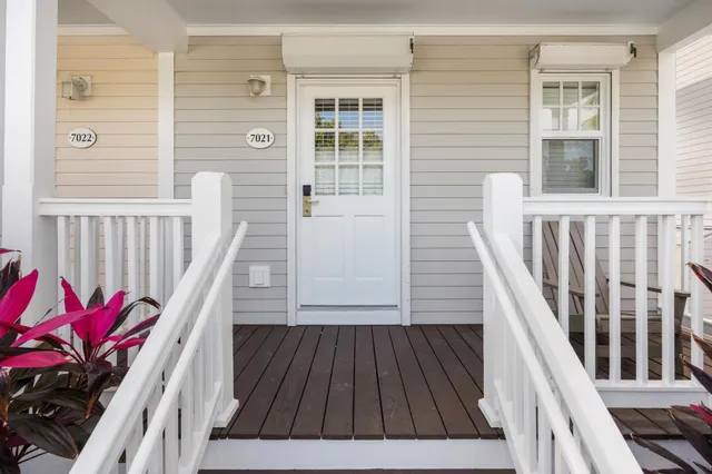 a view of a balcony with wooden floor and stairs