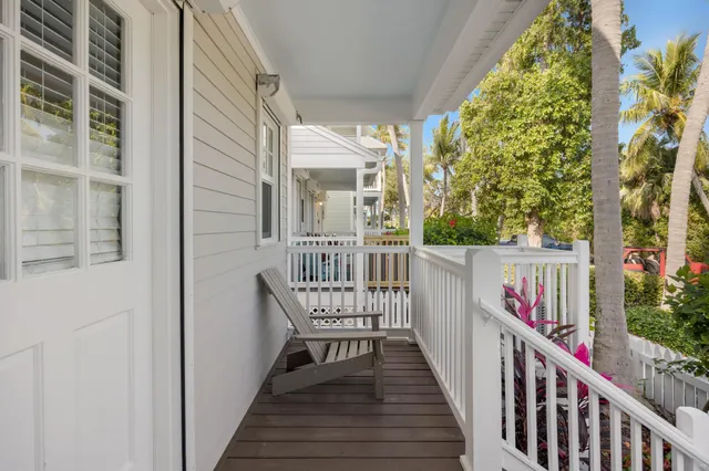 a view of a balcony with wooden floor