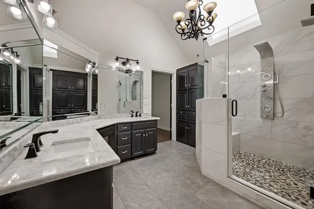 a bathroom with a sink vanity and a mirror