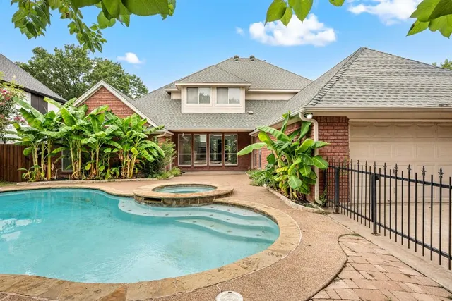 a swimming pool with outdoor seating
