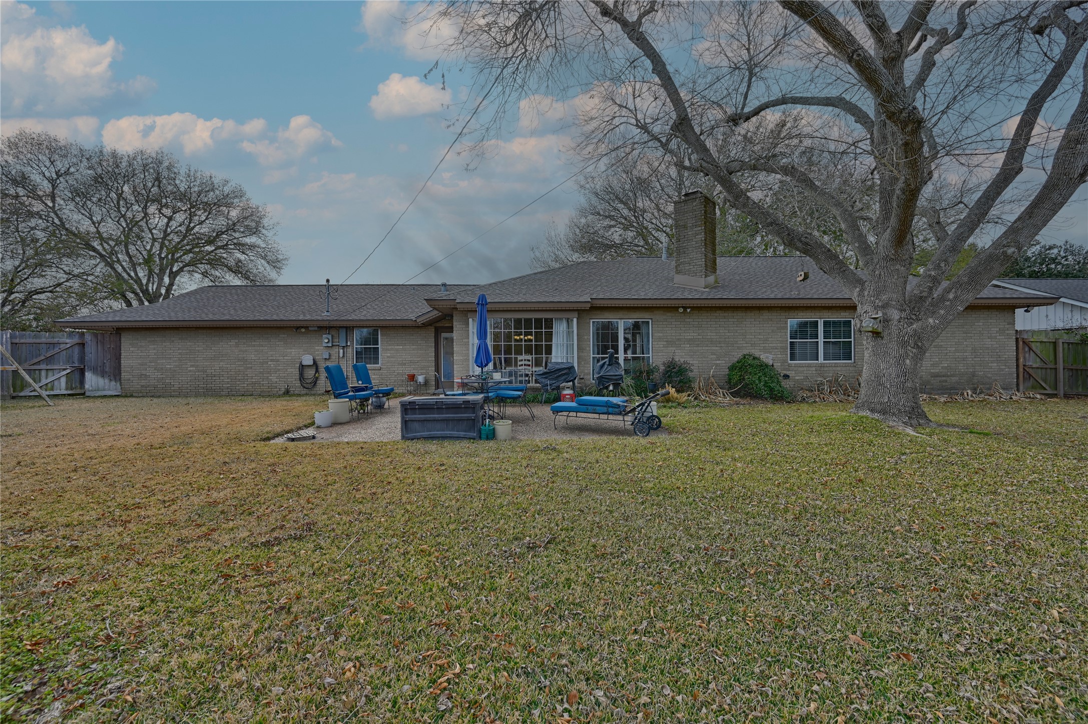 2007 Geney Street Brenham, TX 77833 - Photo 16 of 18 a front view of a house with garden and patio