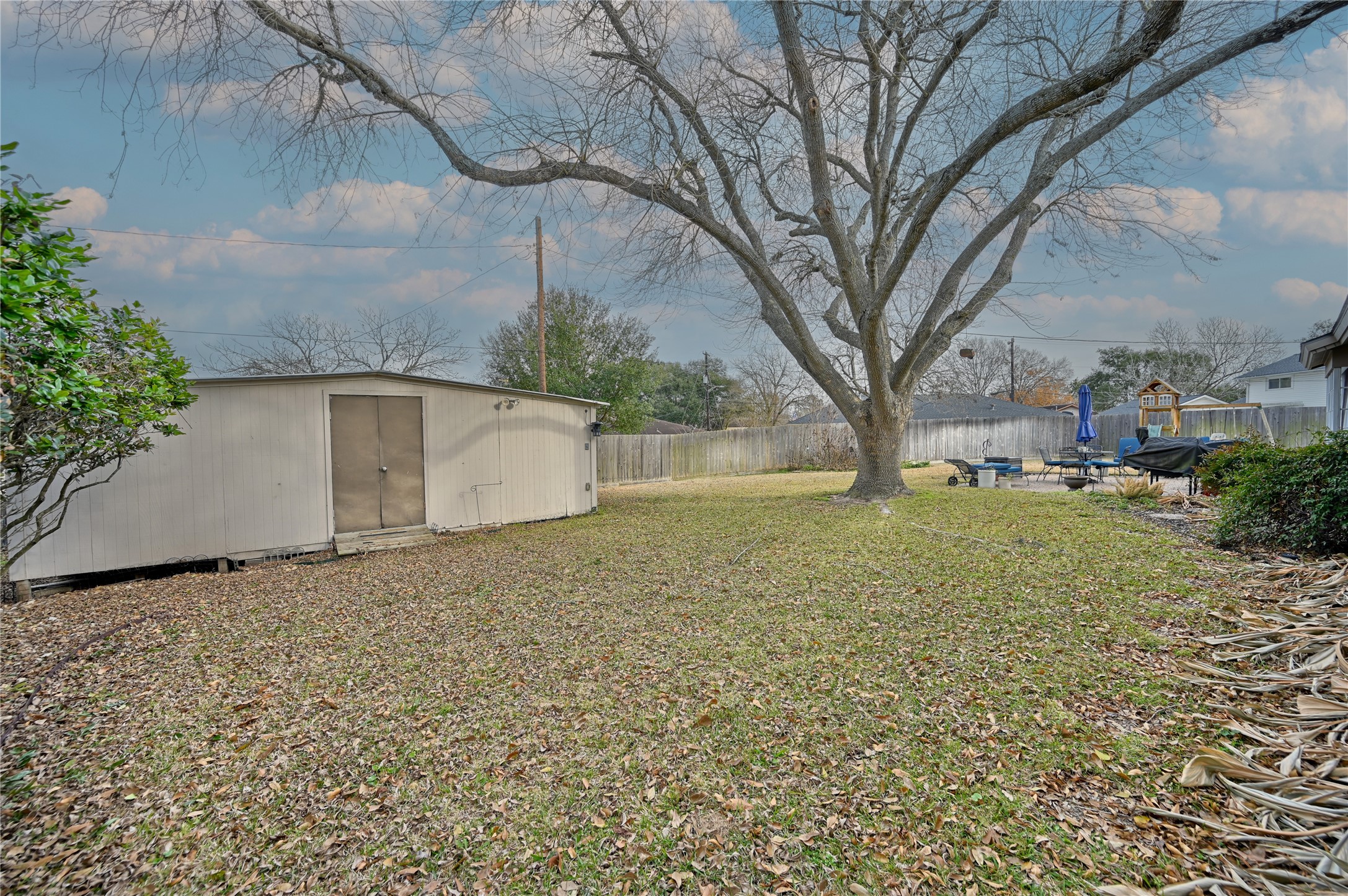 2007 Geney Street Brenham, TX 77833 - Photo 17 of 18 a backyard of a house with lots of green space