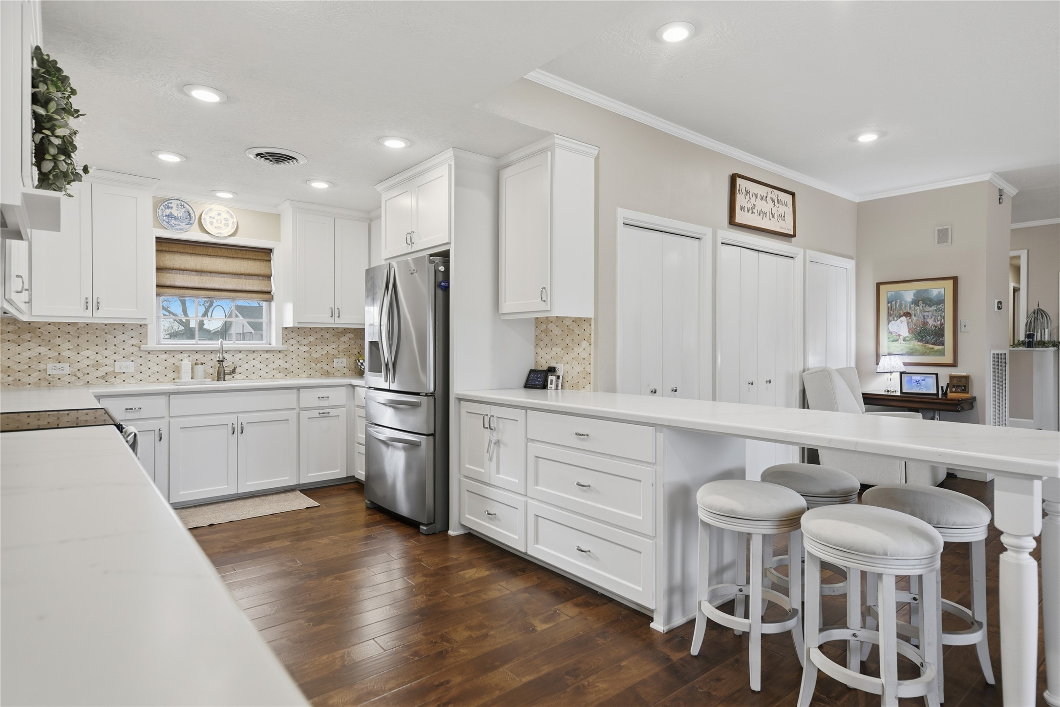 2007 Geney Street Brenham, TX 77833 - Photo 3 of 18 a kitchen with white cabinets and stainless steel appliances