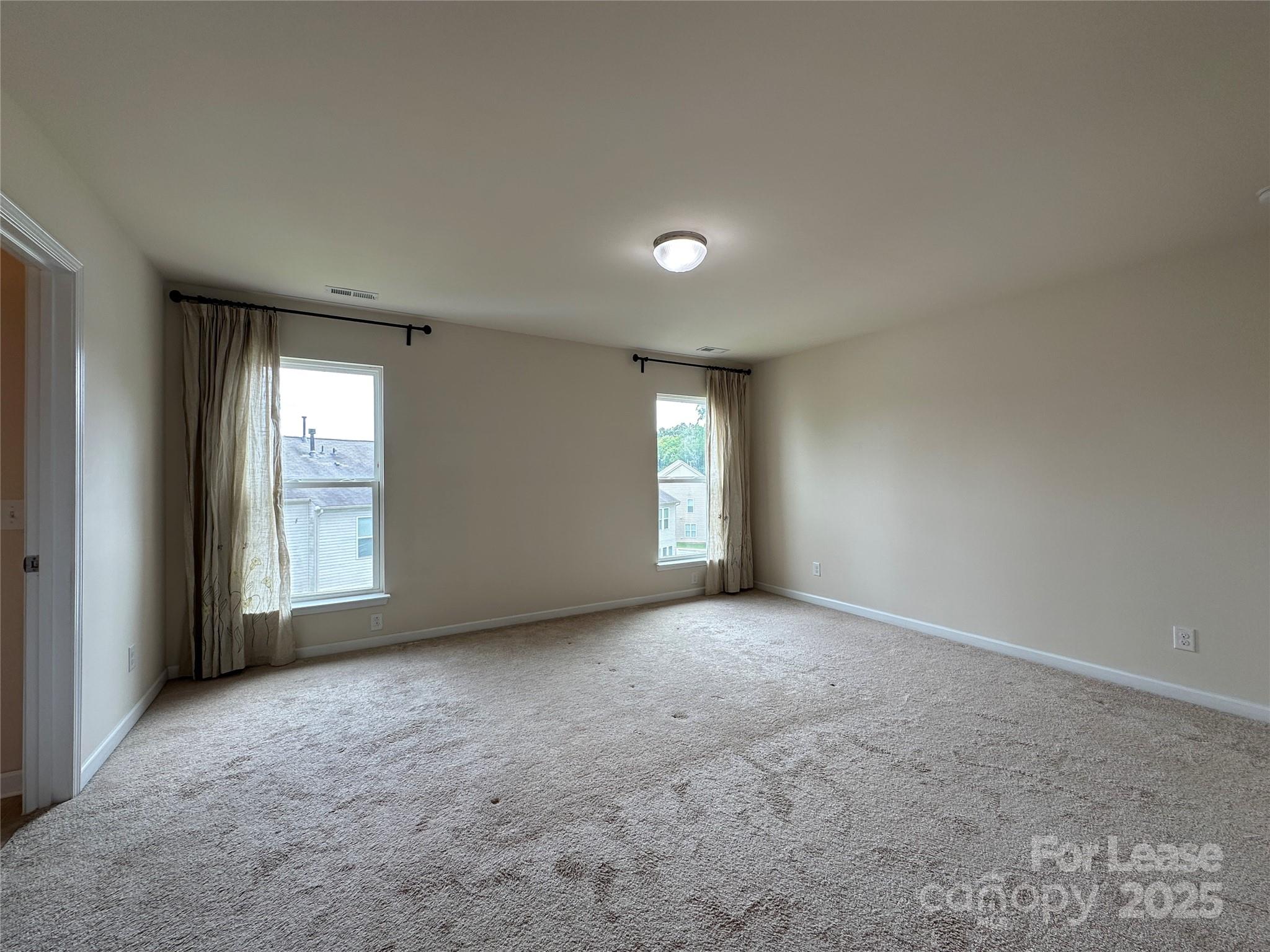 6516 Portland Rose Lane Charlotte, NC 28210 - Photo 15 of 22 an empty room with windows