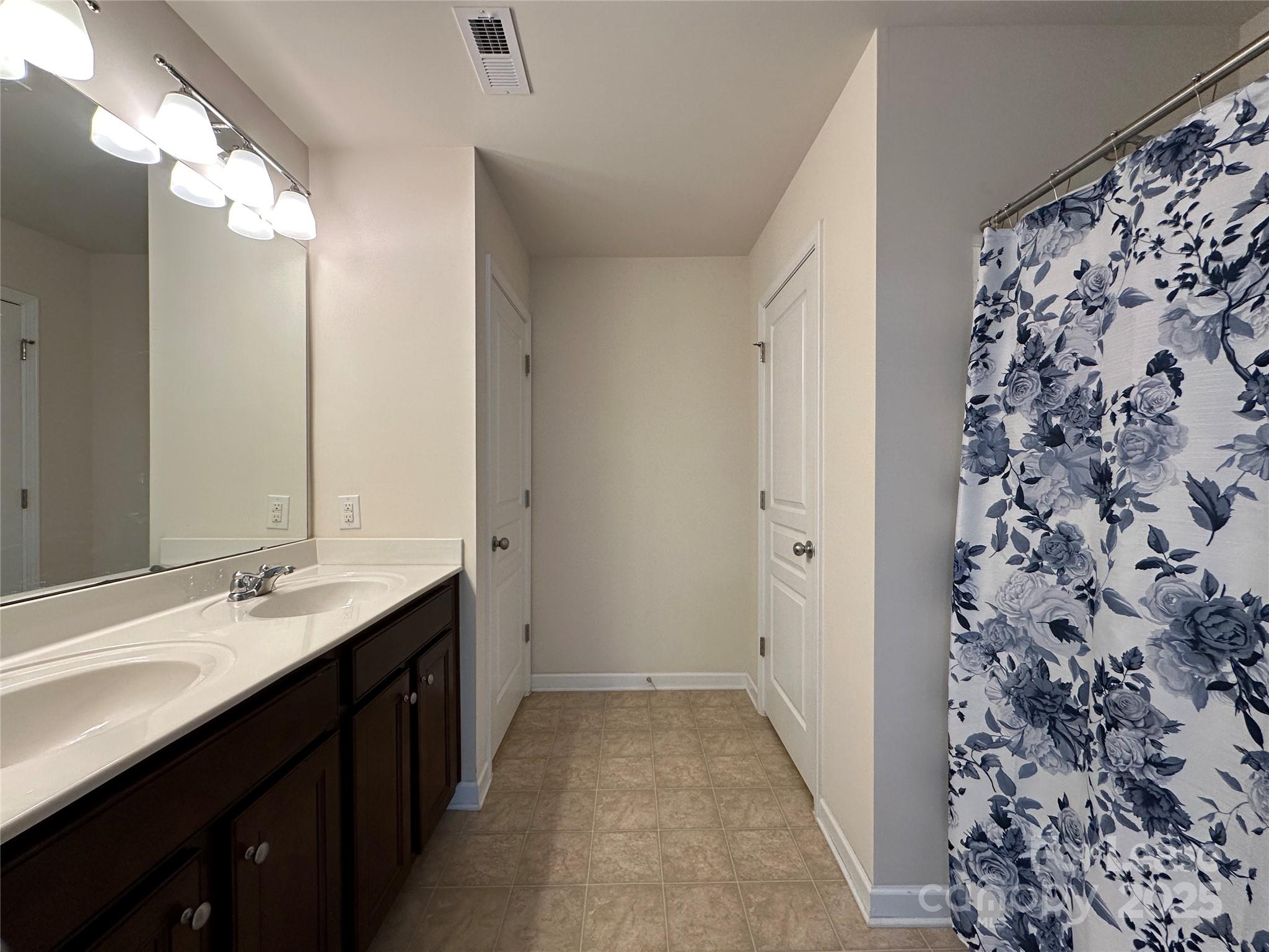 6516 Portland Rose Lane Charlotte, NC 28210 - Photo 17 of 22 a bathroom with a sink and a mirror