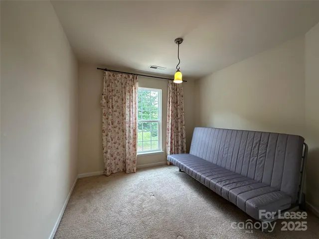 an empty room with a empty space and a window