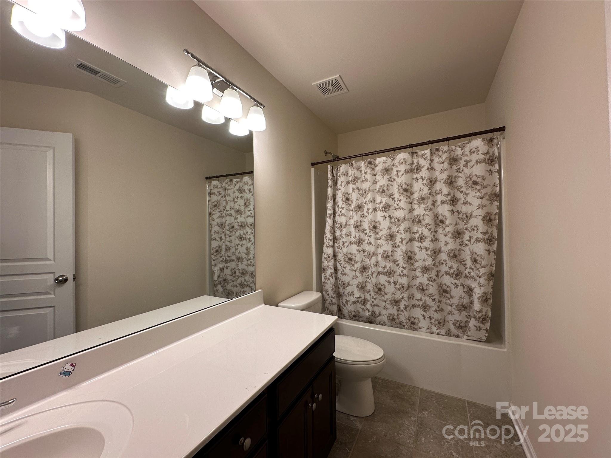 6516 Portland Rose Lane Charlotte, NC 28210 - Photo 20 of 22 a bathroom with a sink a toilet and shower