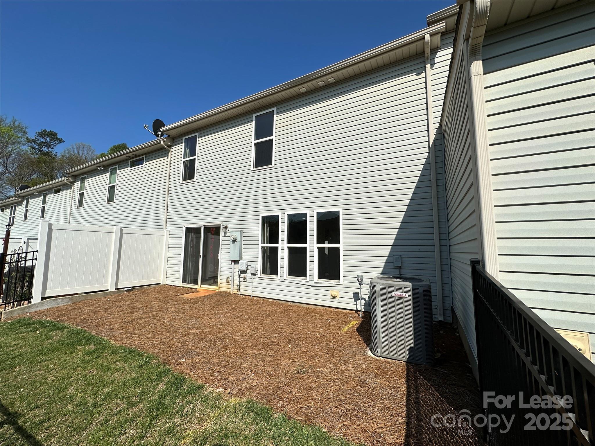 6516 Portland Rose Lane Charlotte, NC 28210 - Photo 22 of 22 a view of a house with a backyard