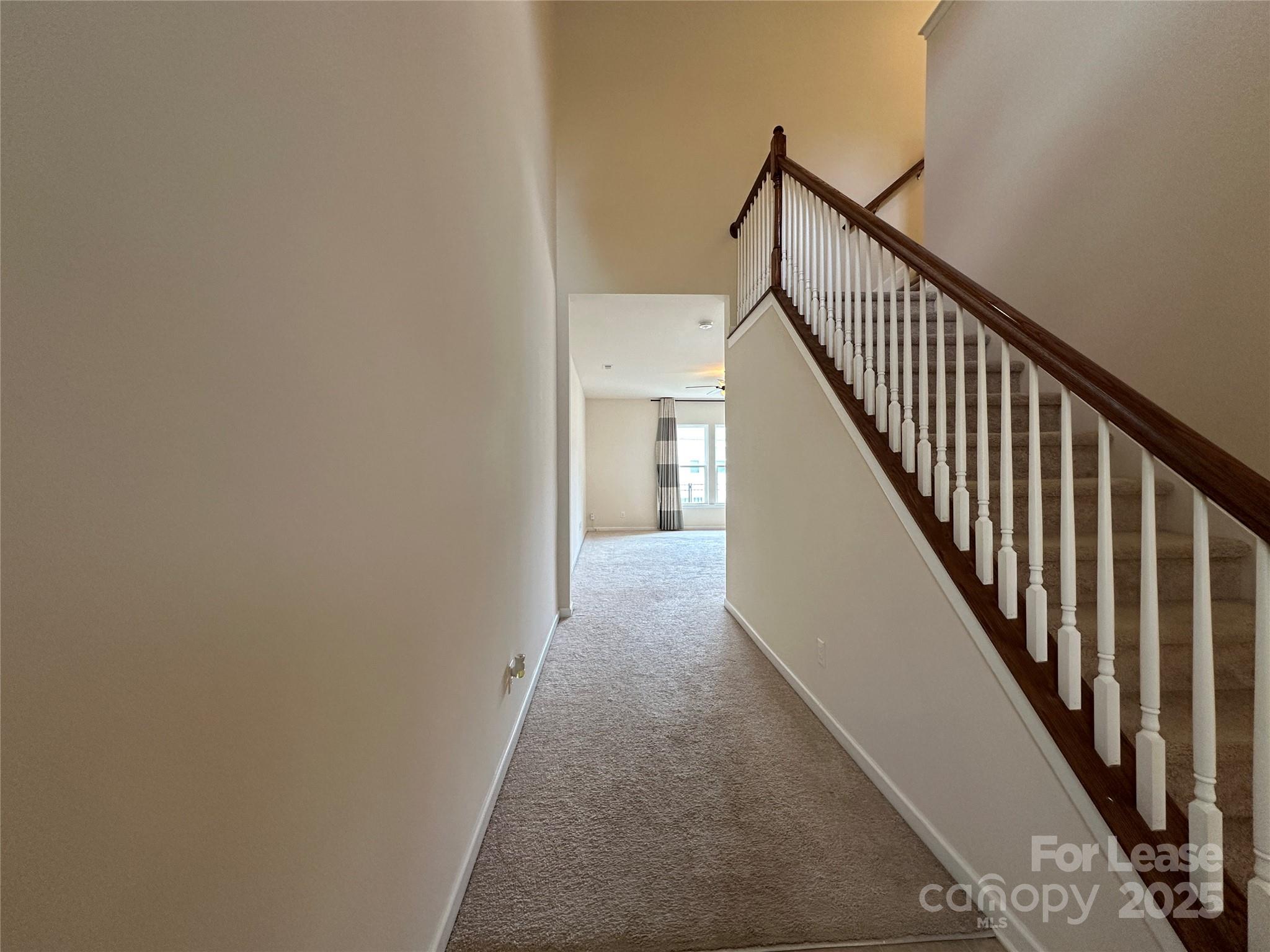 6516 Portland Rose Lane Charlotte, NC 28210 - Photo 3 of 22 a view of a hallway with stairs