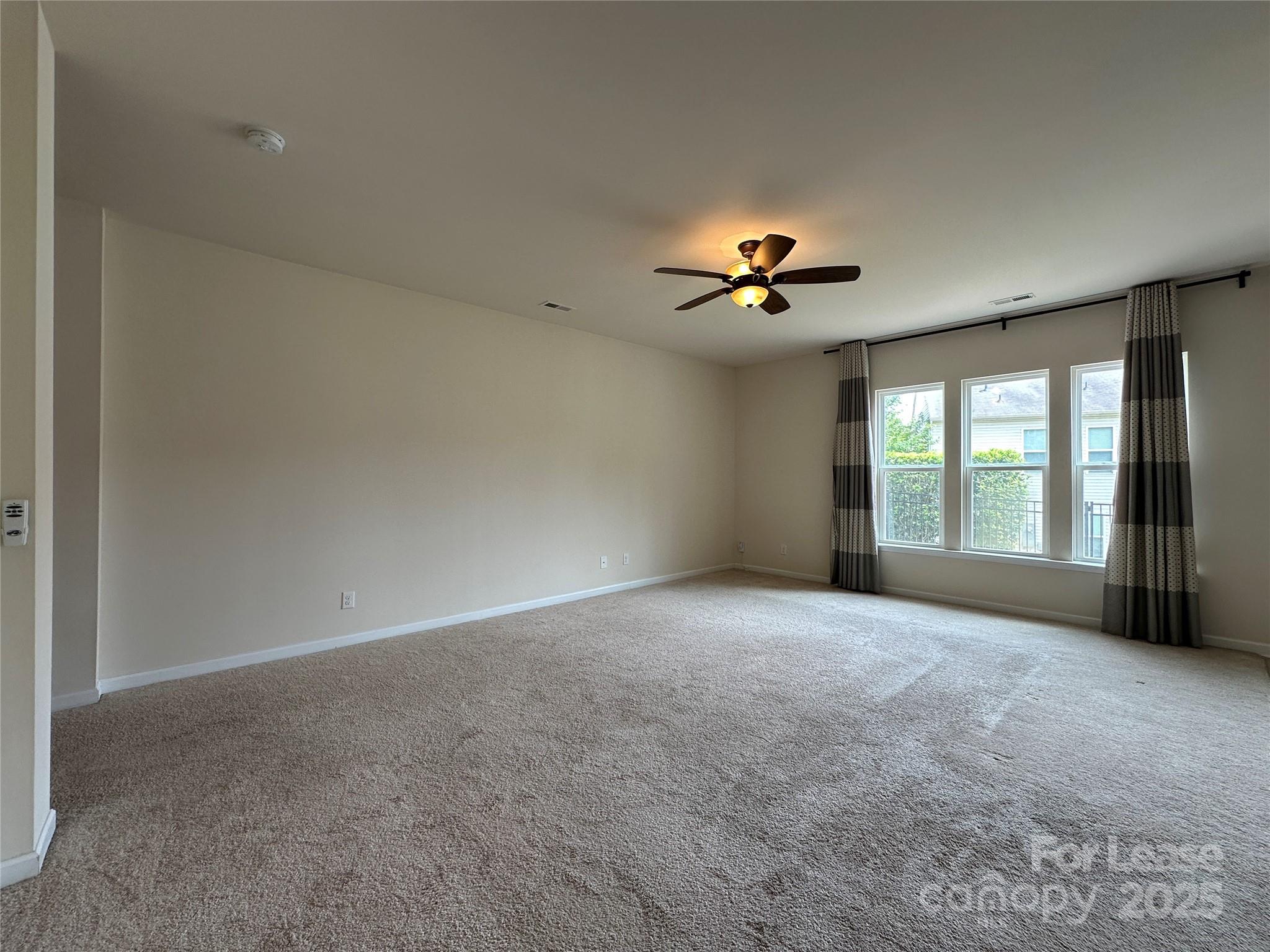 6516 Portland Rose Lane Charlotte, NC 28210 - Photo 6 of 22 a view of an empty room with a window
