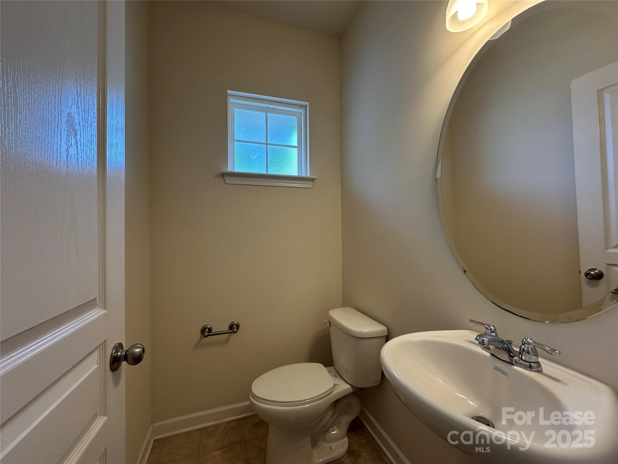 6516 Portland Rose Lane Charlotte, NC 28210 - Photo 7 of 22 a bathroom with a sink and a toilet