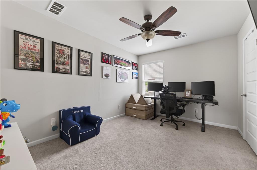 266 Shoals Bridge Road Acworth, GA 30102 - Photo 35 of 43 a work room with furniture and a ceiling fan