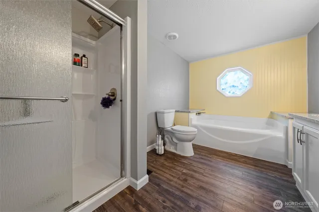 a bathroom with a bathtub and a shower
