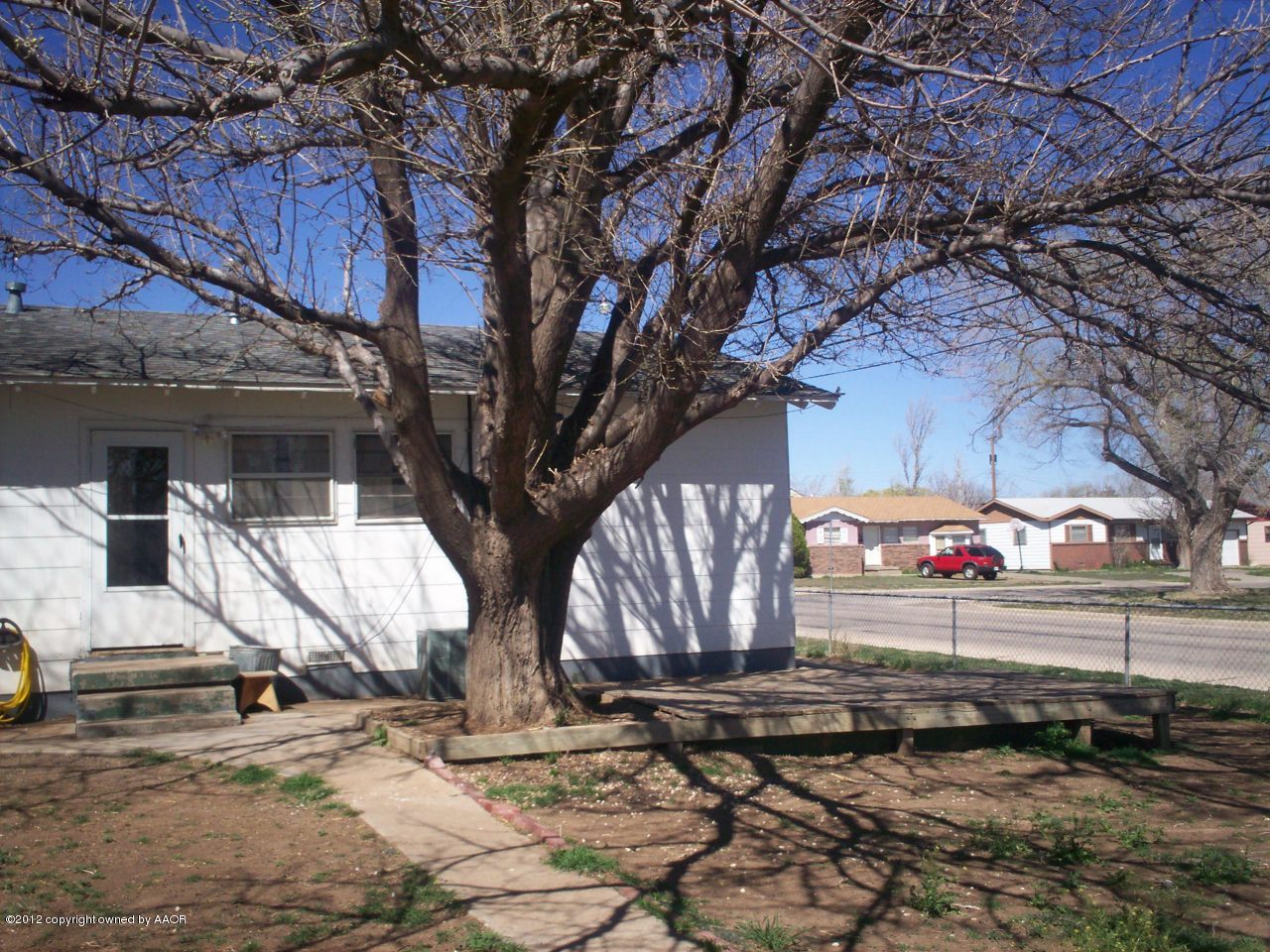 5201 South Travis Street Amarillo, TX 79110 - Photo 12 of 20 a view of a yard with large trees