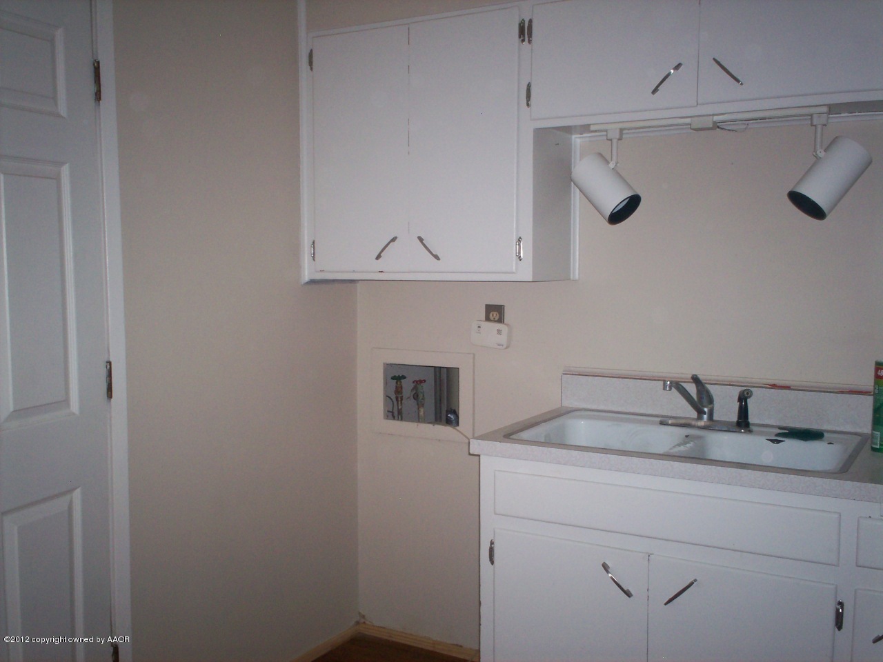 5201 South Travis Street Amarillo, TX 79110 - Photo 5 of 20 a bathroom with a sink and cabinets