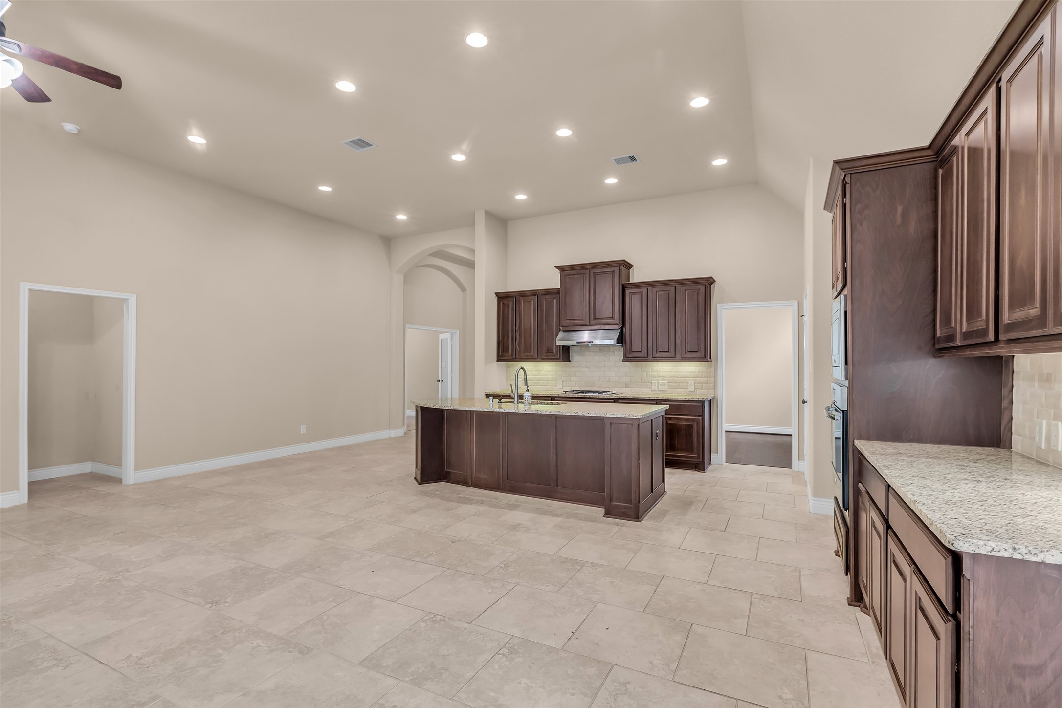 27946 Emory Cove Drive Spring, TX 77386 - Photo 15 of 25 a large kitchen with a large counter top stainless steel appliances and cabinets