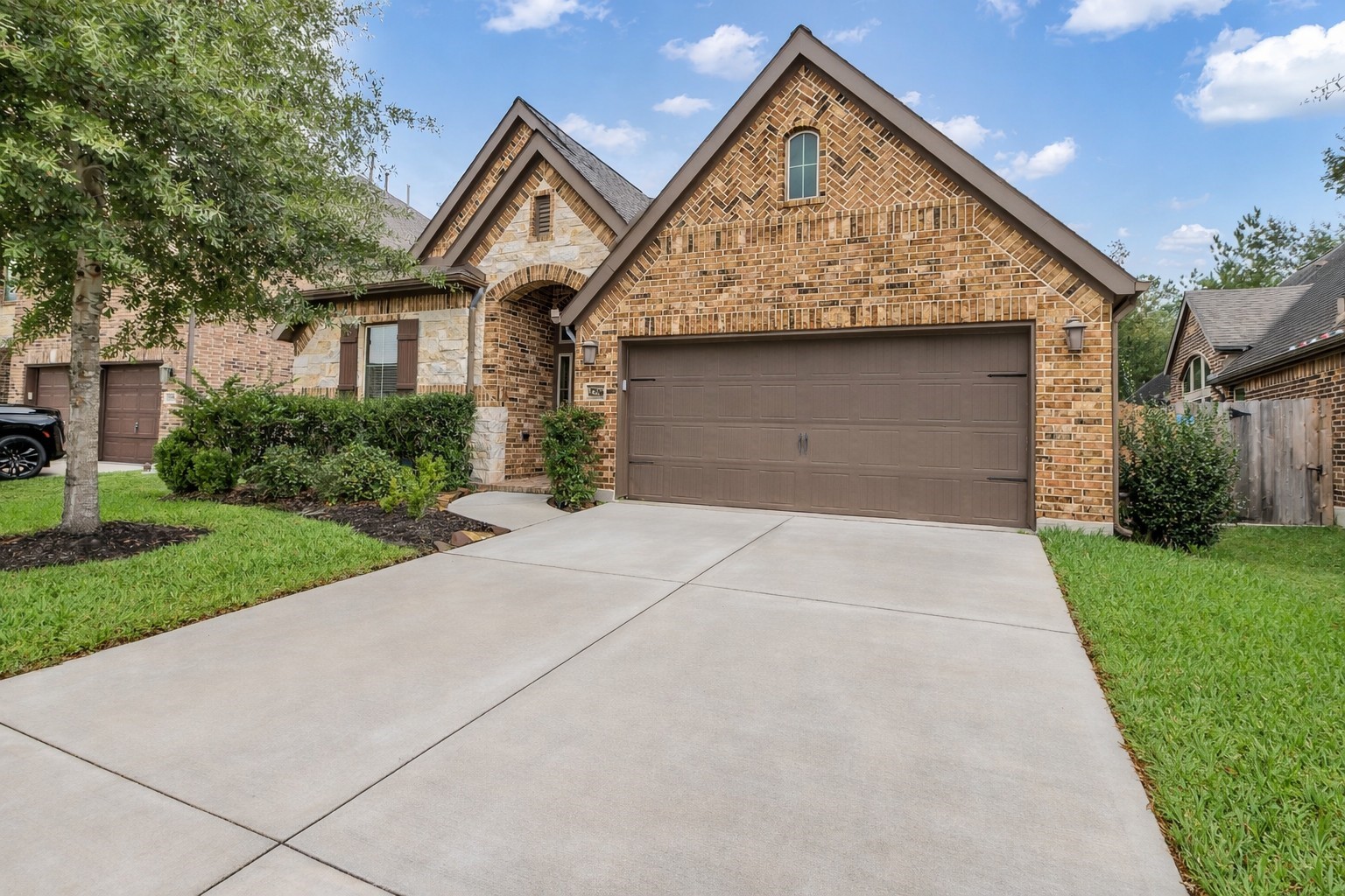 27946 Emory Cove Drive Spring, TX 77386 - Photo 2 of 25 a front view of a house with garden