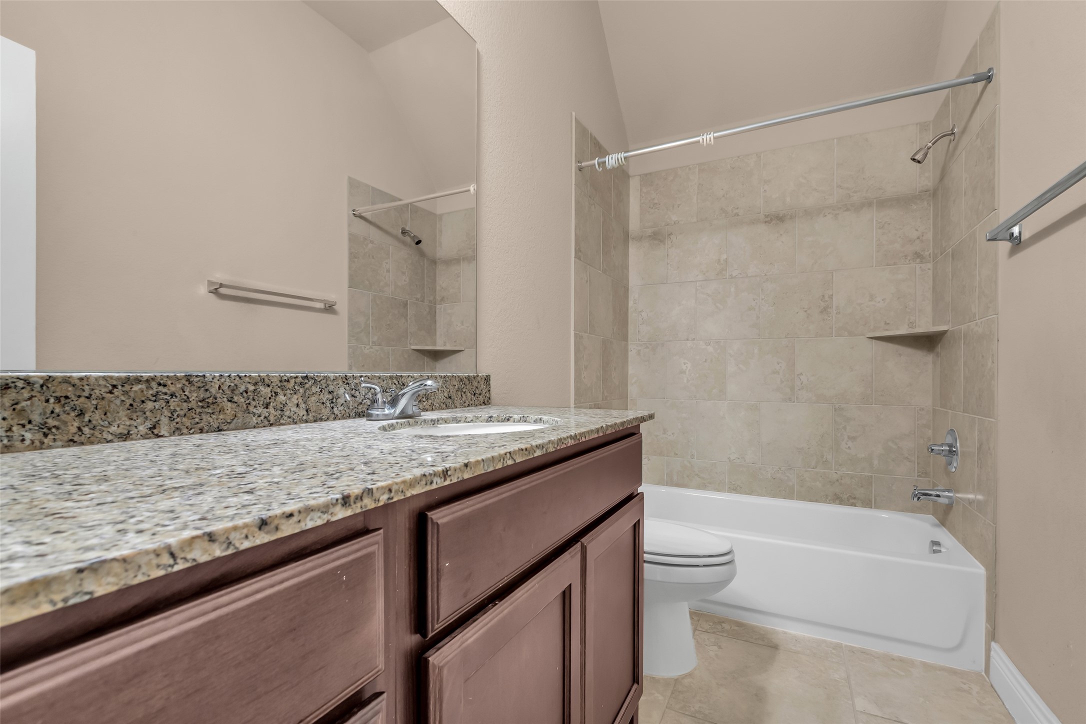 27946 Emory Cove Drive Spring, TX 77386 - Photo 22 of 25 a bathroom with a granite countertop sink toilet and shower