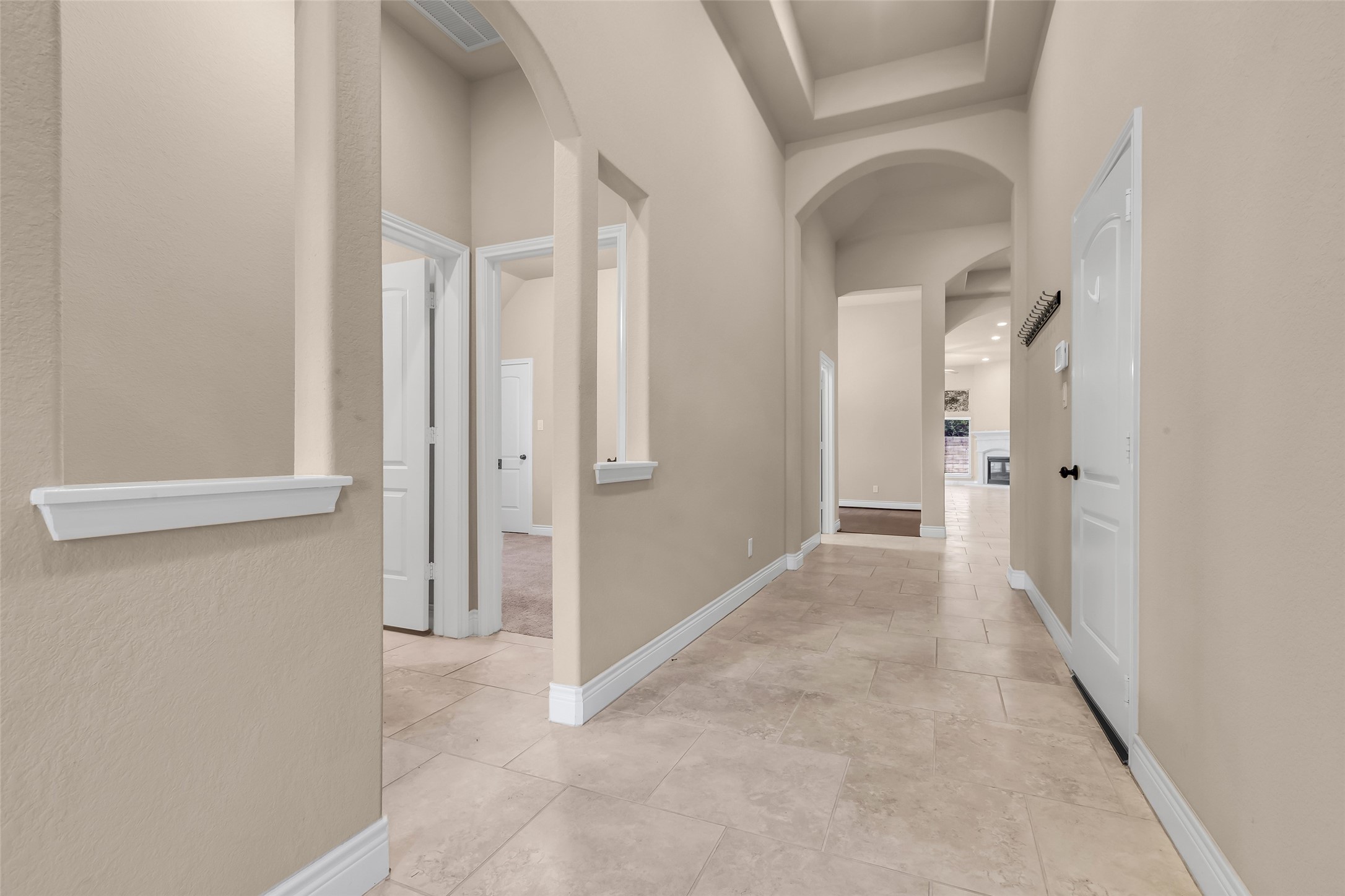 27946 Emory Cove Drive Spring, TX 77386 - Photo 3 of 25 a view of a hallway with wooden floor and staircase