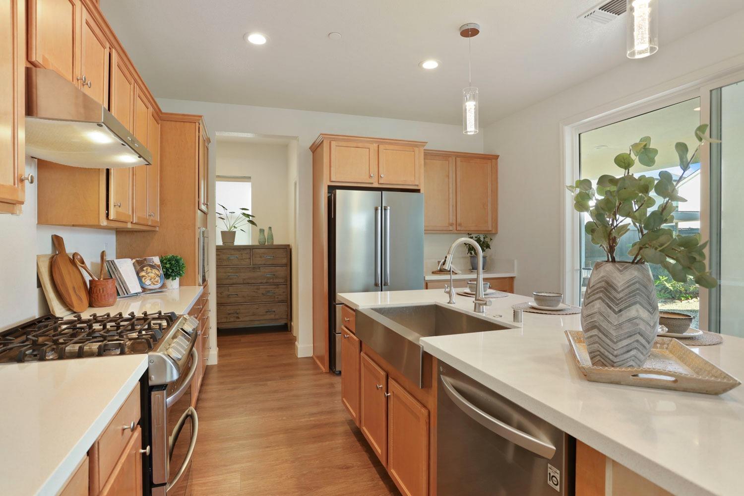 3081 Rio Grande Drive Tracy, CA 95377 - Photo 15 of 60 a kitchen with stainless steel appliances granite countertop a sink stove and refrigerator