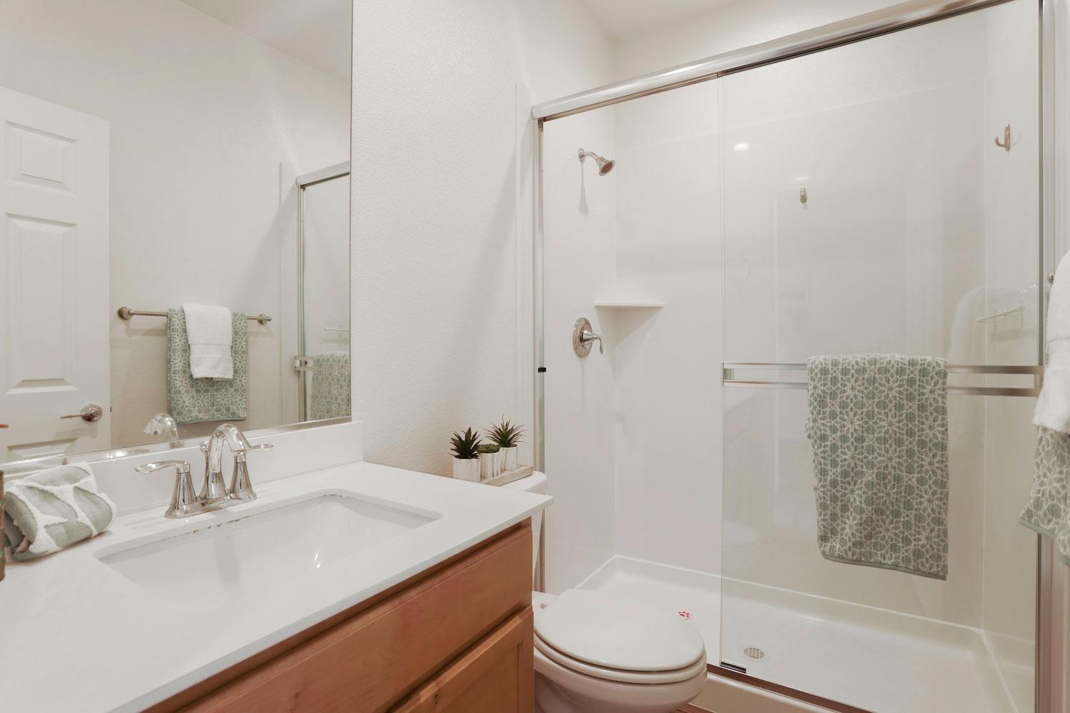 3081 Rio Grande Drive Tracy, CA 95377 - Photo 24 of 60 a bathroom with a granite countertop sink toilet and shower
