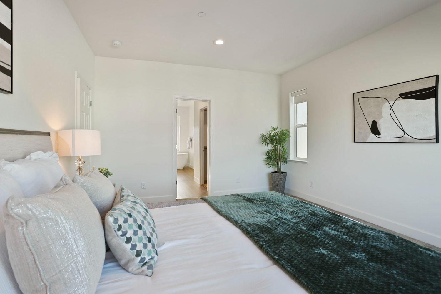 3081 Rio Grande Drive Tracy, CA 95377 - Photo 32 of 60 a bedroom with a bed and a painting on the wall