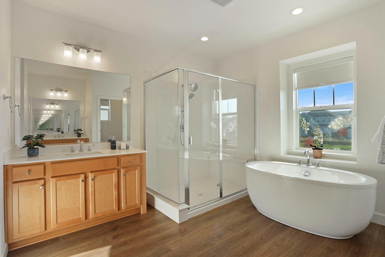 3081 Rio Grande Drive Tracy, CA 95377 - Photo 37 of 60 a bathroom with a tub sink shower and mirror