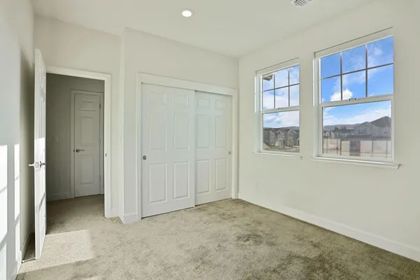 a view of a hallway with washer and dryer
