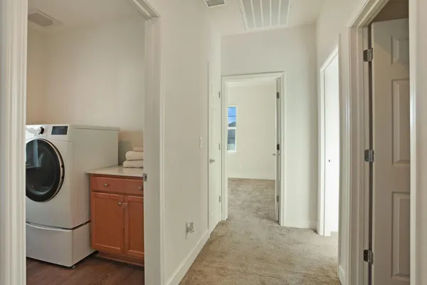 a view of a backyard with plants and patio