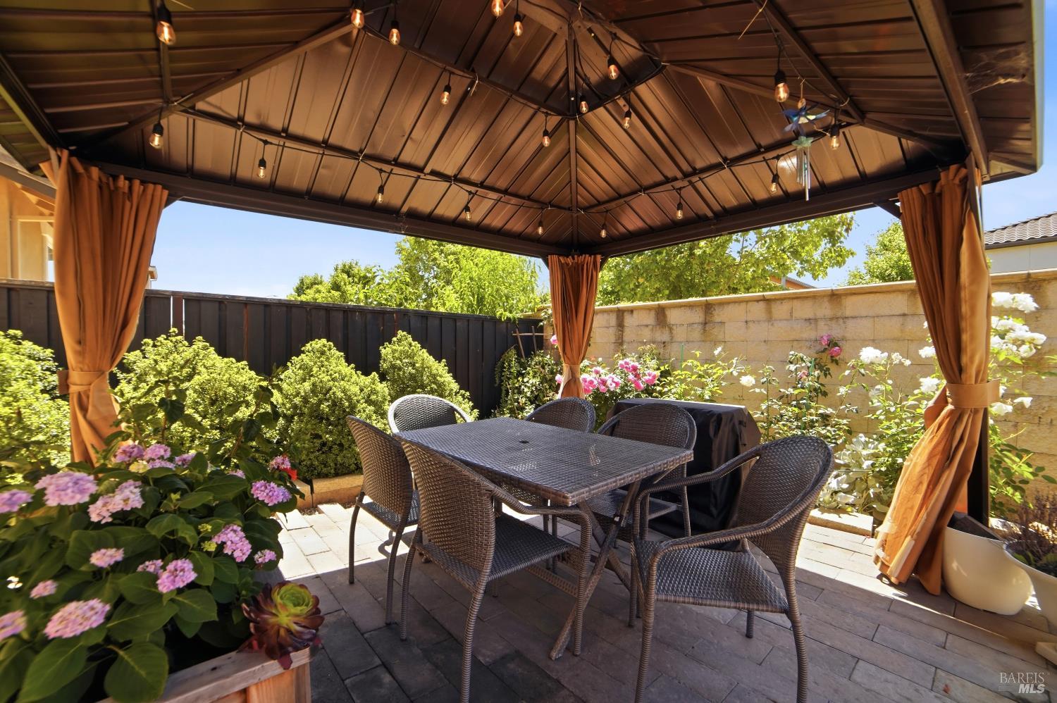 5305 Kirby Place Rohnert Park, CA 94928 - Photo 33 of 37 a view of a patio with table and chairs potted plants with wooden floor