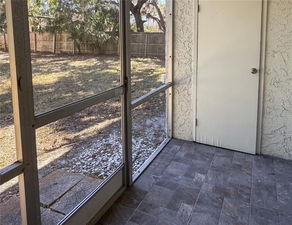 377 South McMullen Booth Road, Unit 97 Clearwater, FL 33759 - Photo 15 of 21 a view of a glass door and a window