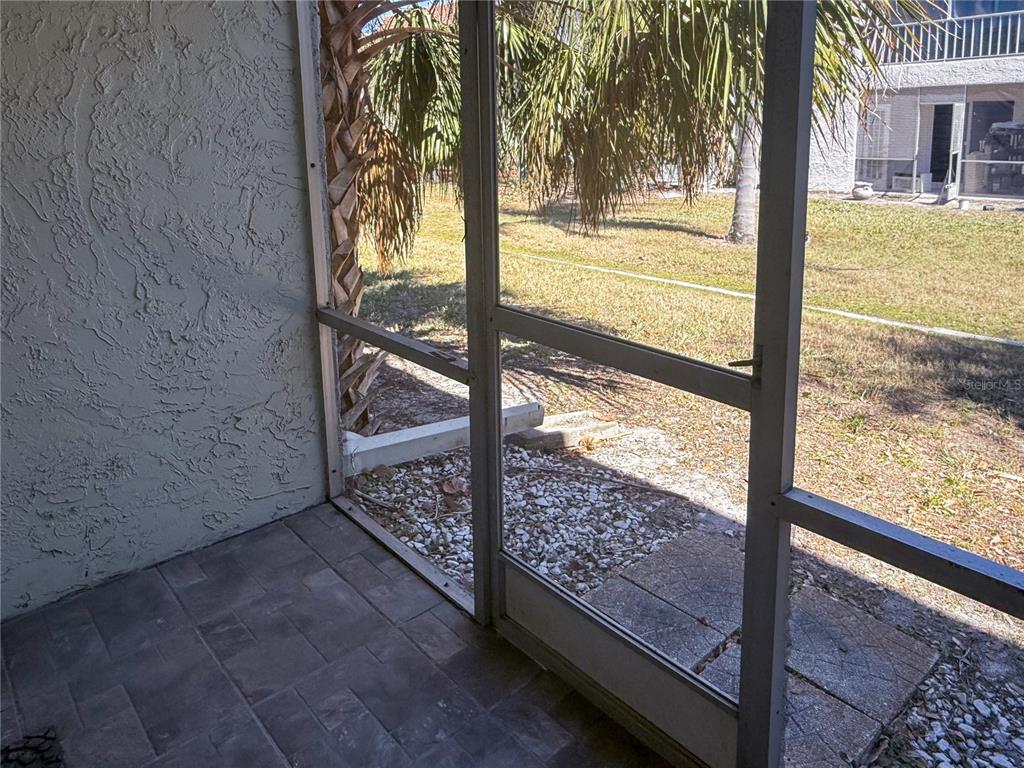 377 South McMullen Booth Road, Unit 97 Clearwater, FL 33759 - Photo 16 of 21 a view of a porch with wooden floor and fence