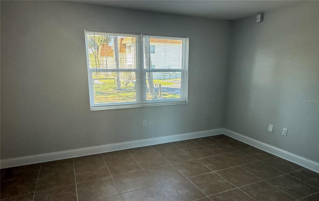 377 South McMullen Booth Road, Unit 97 Clearwater, FL 33759 - Photo 4 of 21 an empty room with a window