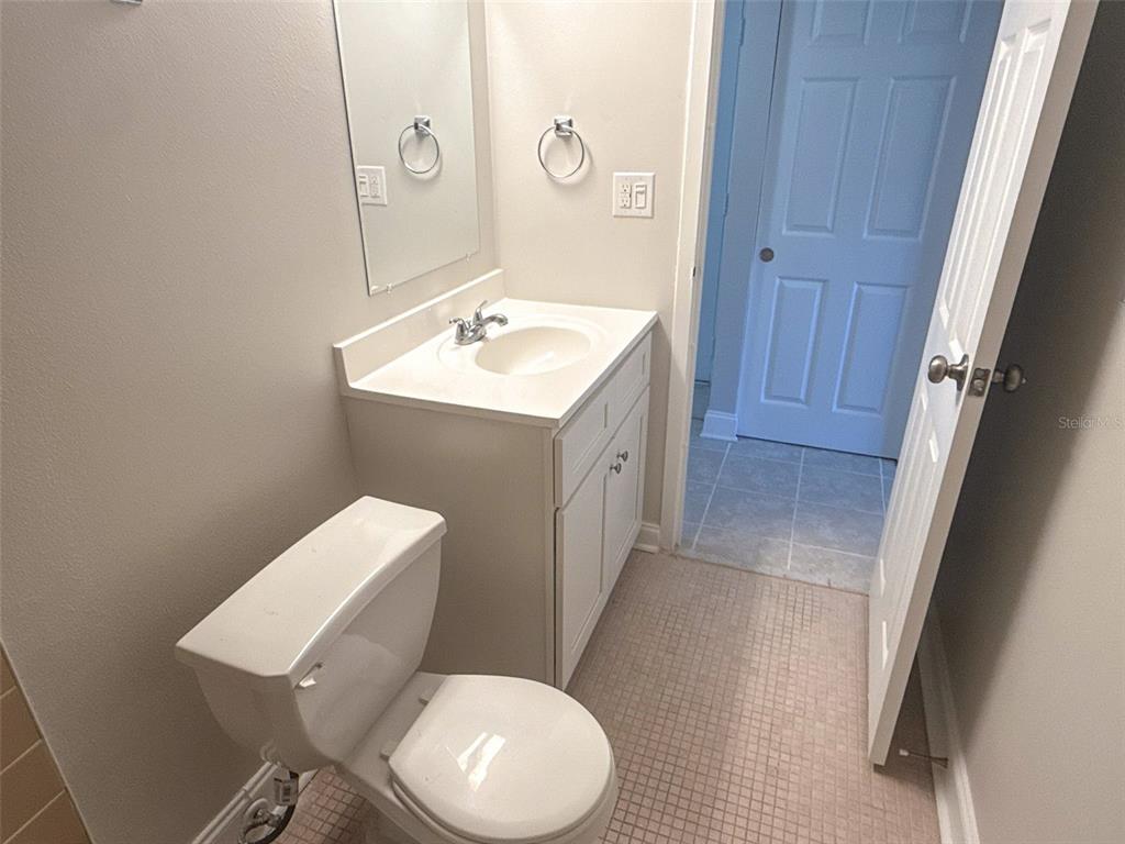 377 South McMullen Booth Road, Unit 97 Clearwater, FL 33759 - Photo 7 of 21 a bathroom with a toilet sink and mirror