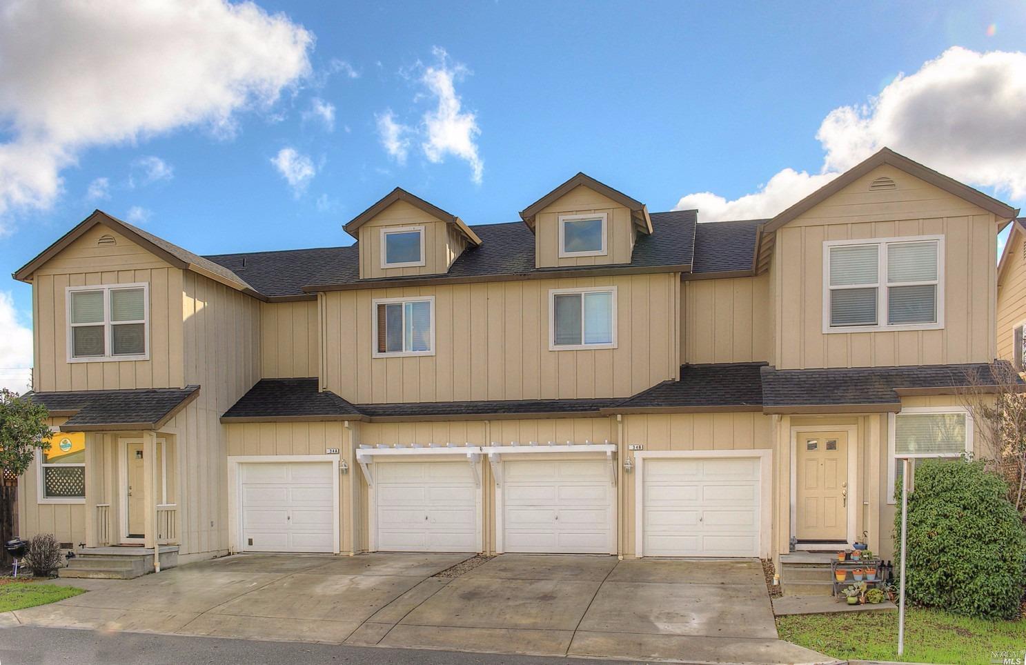 34 Randall Lane Santa Rosa, CA 95409 - Photo 1 of 1 a front view of a house with lots of garage and windows