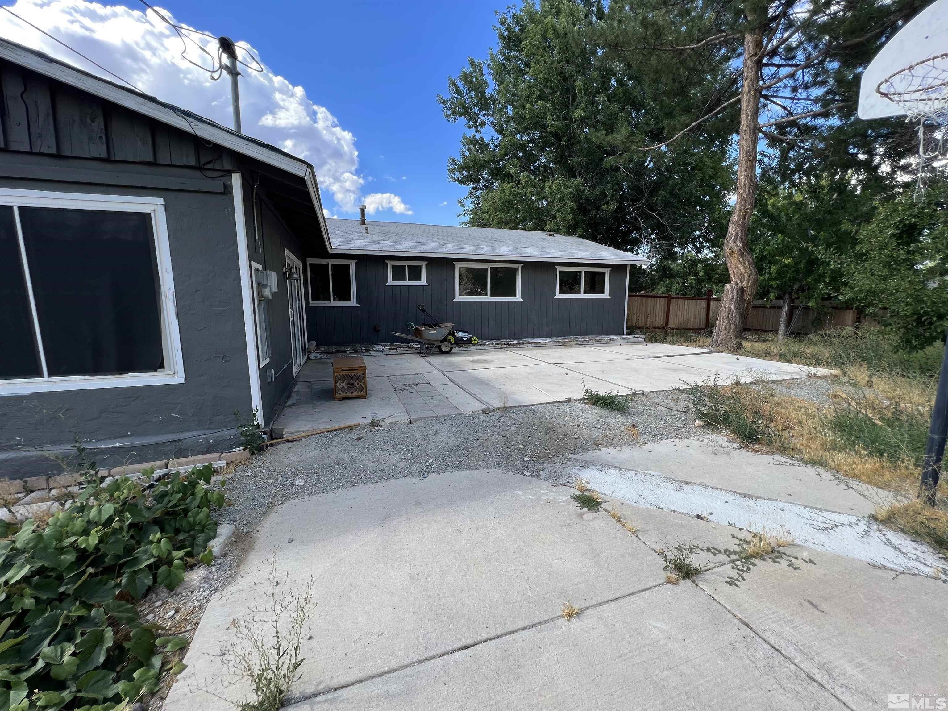 9120 Fremont Way Reno, NV 89506 - Photo 14 of 15 a front view of a house with a yard