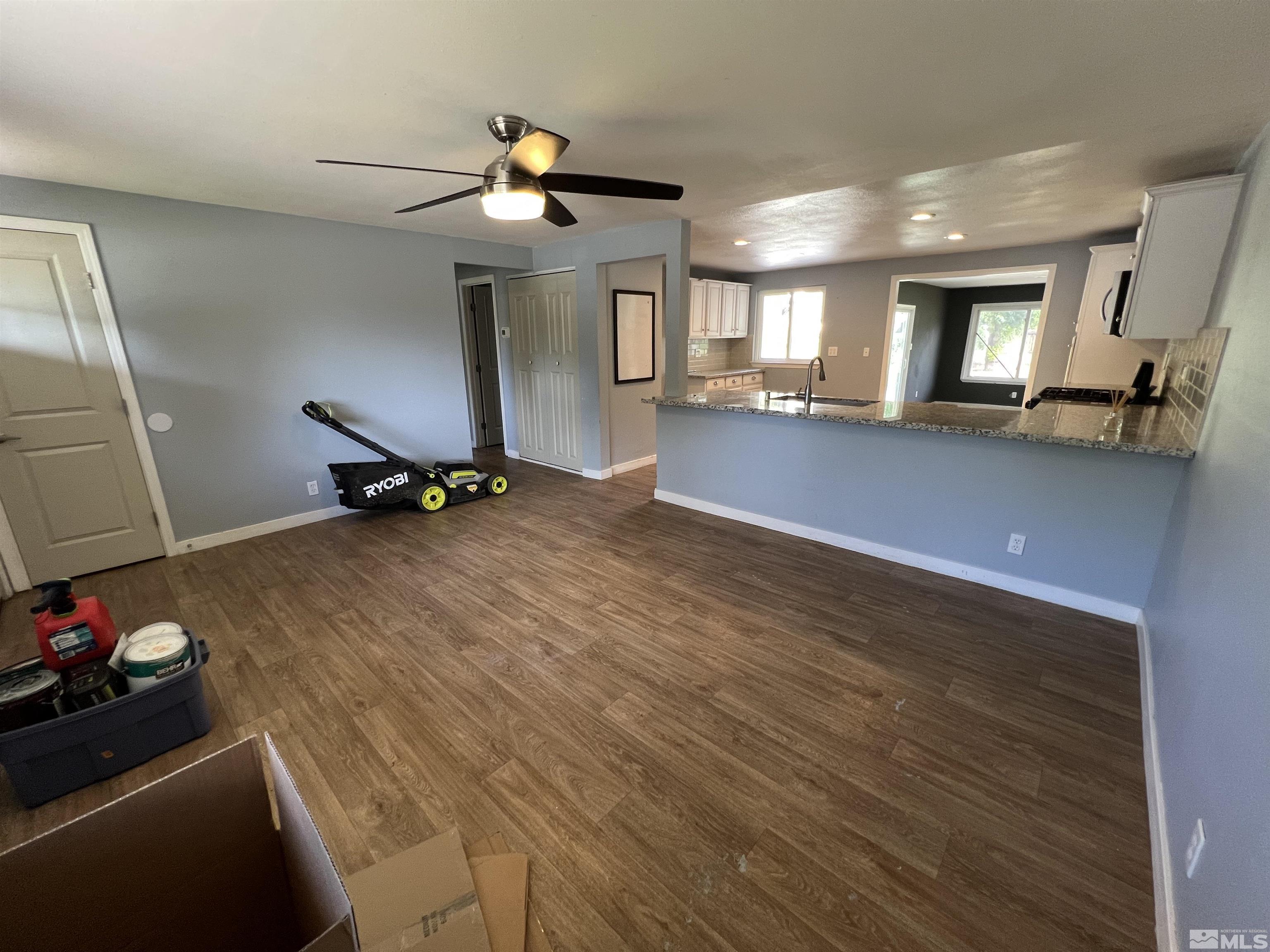 9120 Fremont Way Reno, NV 89506 - Photo 3 of 15 a room with gym equipment and a mirror