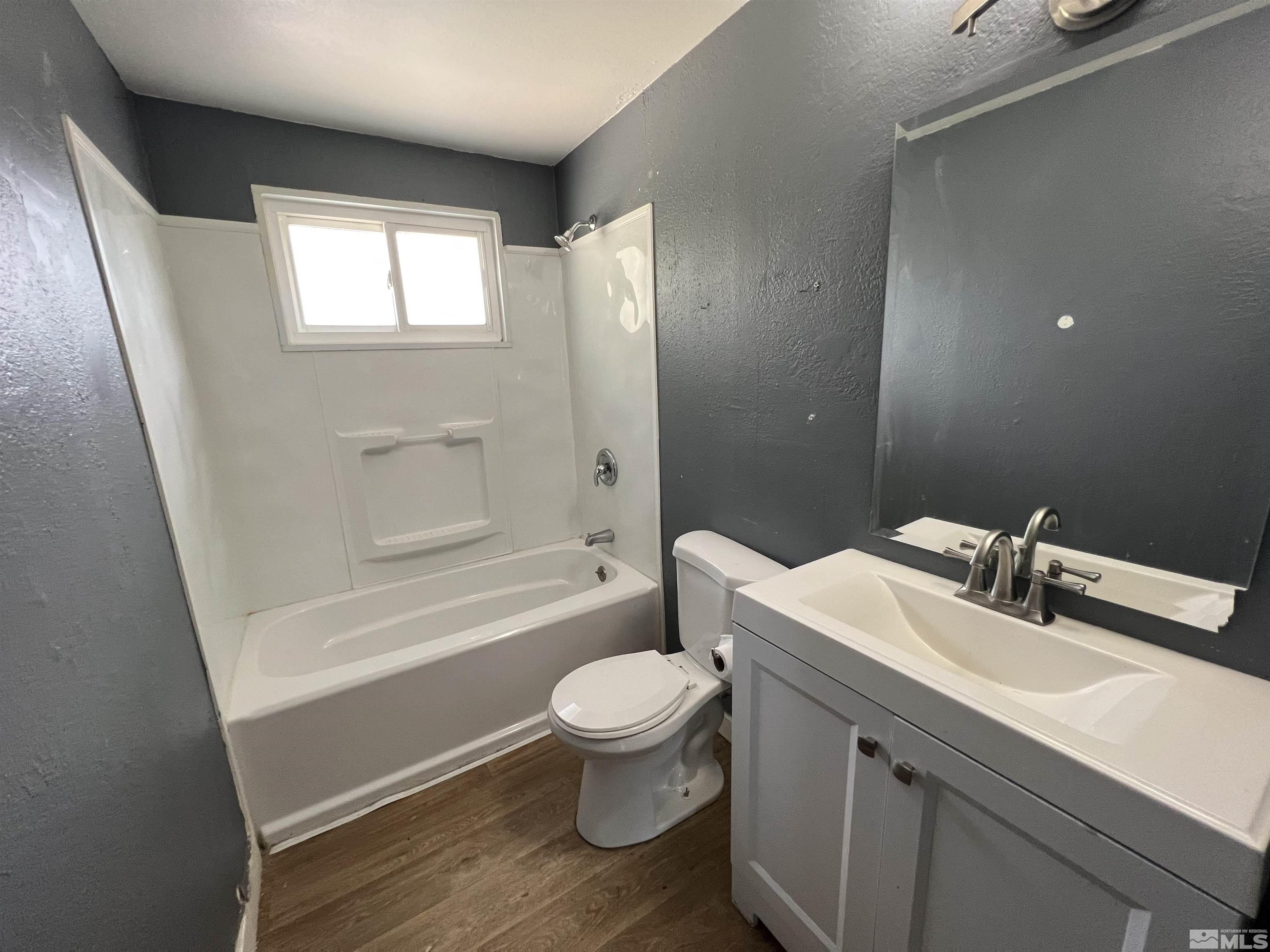 9120 Fremont Way Reno, NV 89506 - Photo 6 of 15 a bathroom with a sink a toilet and shower