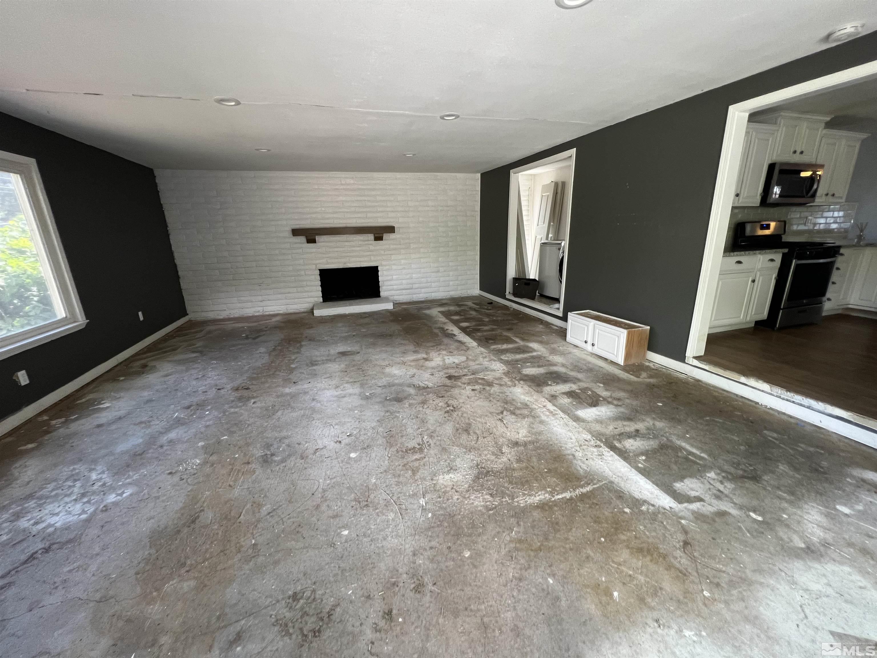 9120 Fremont Way Reno, NV 89506 - Photo 8 of 15 a view of empty room with wooden floor and window