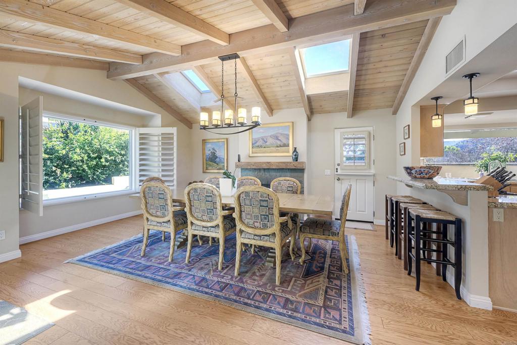 16142 El Tae Road Pauma Valley, CA 92061 - Photo 11 of 63 a dining room with furniture a rug and a chandelier